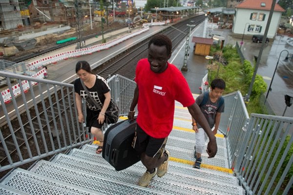 Debate raged after asylum seekers were banned from volunteering as luggage porters at one southern train station. Photo: DPA