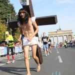 One runner decided to make the marathon his personal Calvary.Photo: DPA