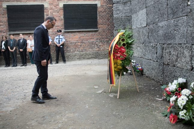 ‘Hell on Earth was a German creation,’ says Foreign Minister on visit to Auschwitz