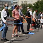 Thousands of Berliners form socially-distanced human chain against racism