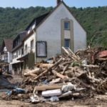 Merkel demands faster climate action as German flood death toll rises                