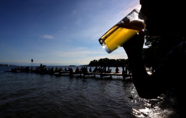 A man enjoys a beer at the Starnberger See in Bavaria in early October.