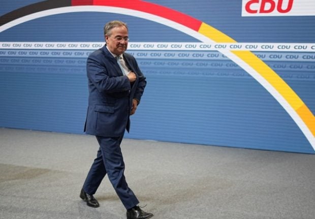 CDU leader Armin Laschet walks away after giving a press conference in Berlin.