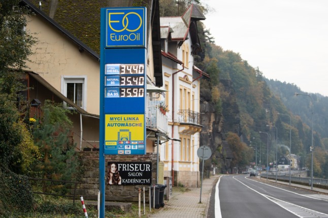 A petrol station displays prices in Czech krona