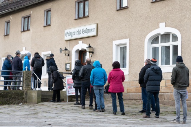 People queue at a vaccination point in Lohmen, Saxony. 