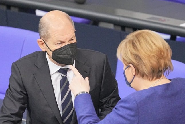 The SPD's Olaf Scholz and the CDU's Angela Merkel in the German Bundestag recently. 