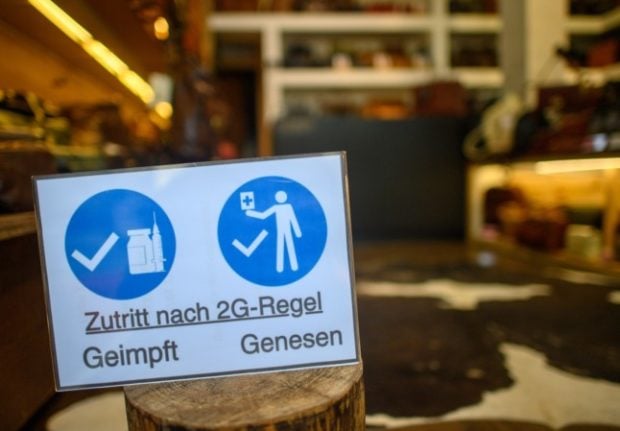 A sign at a shop in Magdeburg, Saxony-Anhalt says entry is only for people who are vaccinated or have recovered from Covid. 