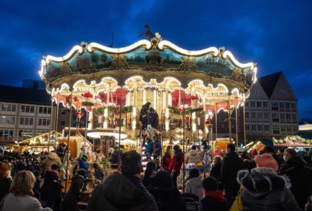 People enjoy a Christmas market in Frankfurt. 
