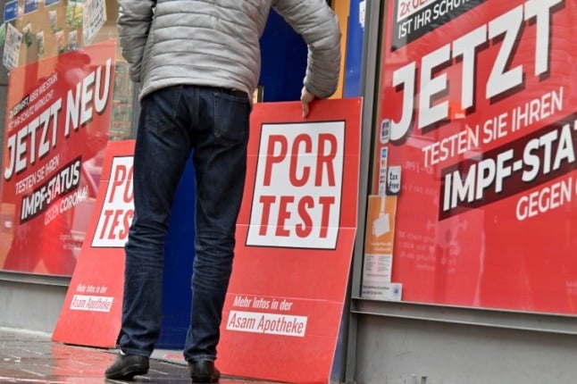 Adverts for PCR testing at a pharmacy in Munich.