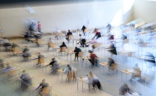 Young people sitting an exam at a school in Dresden.