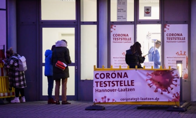 People queue for a Covid test in Laatzen, Lower Saxony. 