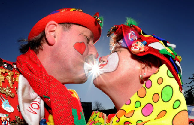 Two Karneval revellers share a kiss on Rosenmontag.